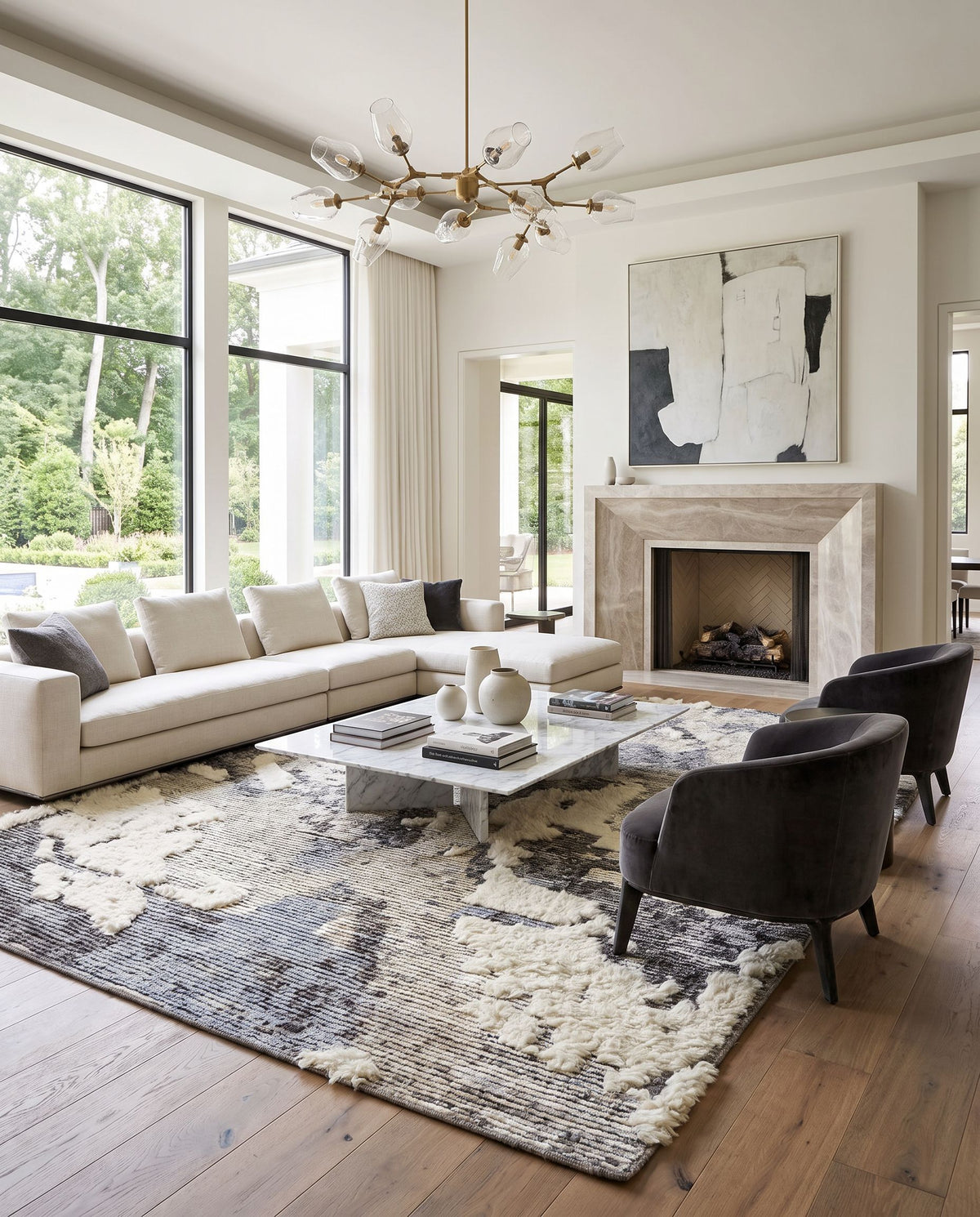 Socrates SOC-2301 Hand Knotted Rug styled in an elegant designer living room — hand knotted modern area rug in cream, black, charcoal and light gray tones