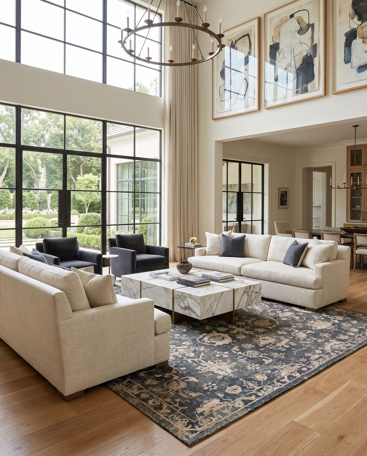 Sufi SUF-2300 Hand Knotted Rug as the centerpiece of a bright luxury living room — a hand knotted traditional area rug in charcoal, tan, taupe and light beige tones