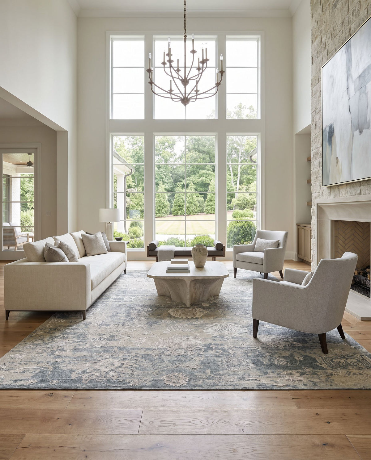 Sufi SUF-2303 Hand Knotted Rug as the centerpiece of a bright luxury living room — a hand knotted traditional area rug in charcoal, light gray, tan and light beige tones