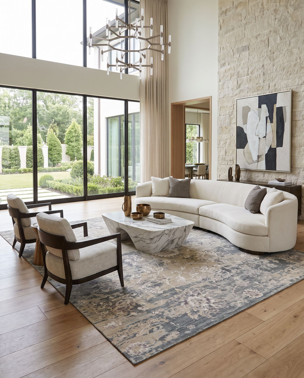 Sufi SUF-2303 Hand Knotted Rug styled in an elegant designer living room — hand knotted traditional area rug in charcoal, light gray, tan and light beige tones