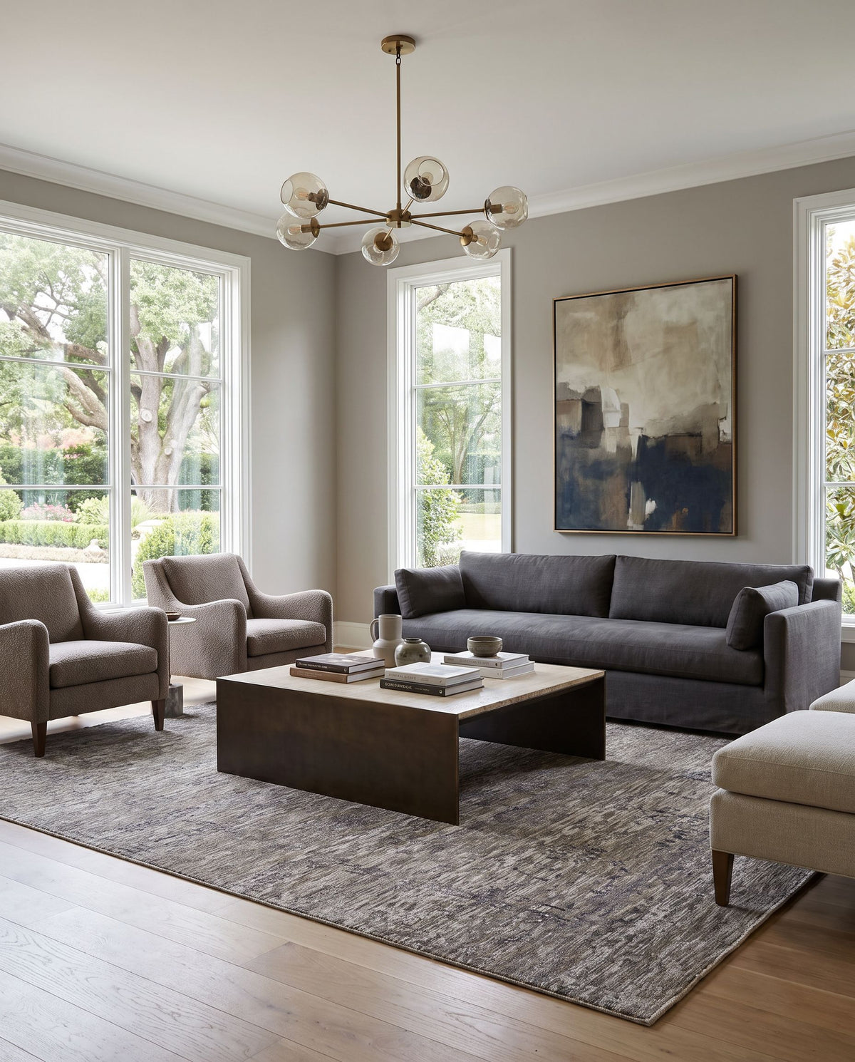 Tabreez TEZ-2301 Hand Knotted Rug styled in an elegant designer living room — hand knotted traditional area rug in black, beige, light gray and dark brown tones