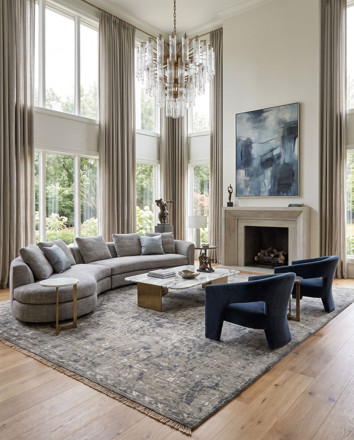 Theodora THO-3011 Hand Knotted Rug as the centerpiece of a bright luxury living room — a hand knotted traditional area rug in charcoal, ice blue, gray and medium gray tones