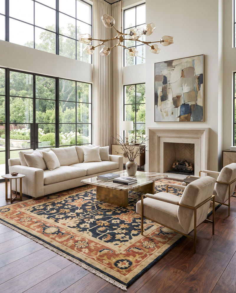 Taj Mahal TJ-6599 Hand Knotted Rug as the centerpiece of a bright luxury living room — a hand knotted traditional area rug in black, burnt orange, tan and mustard tones