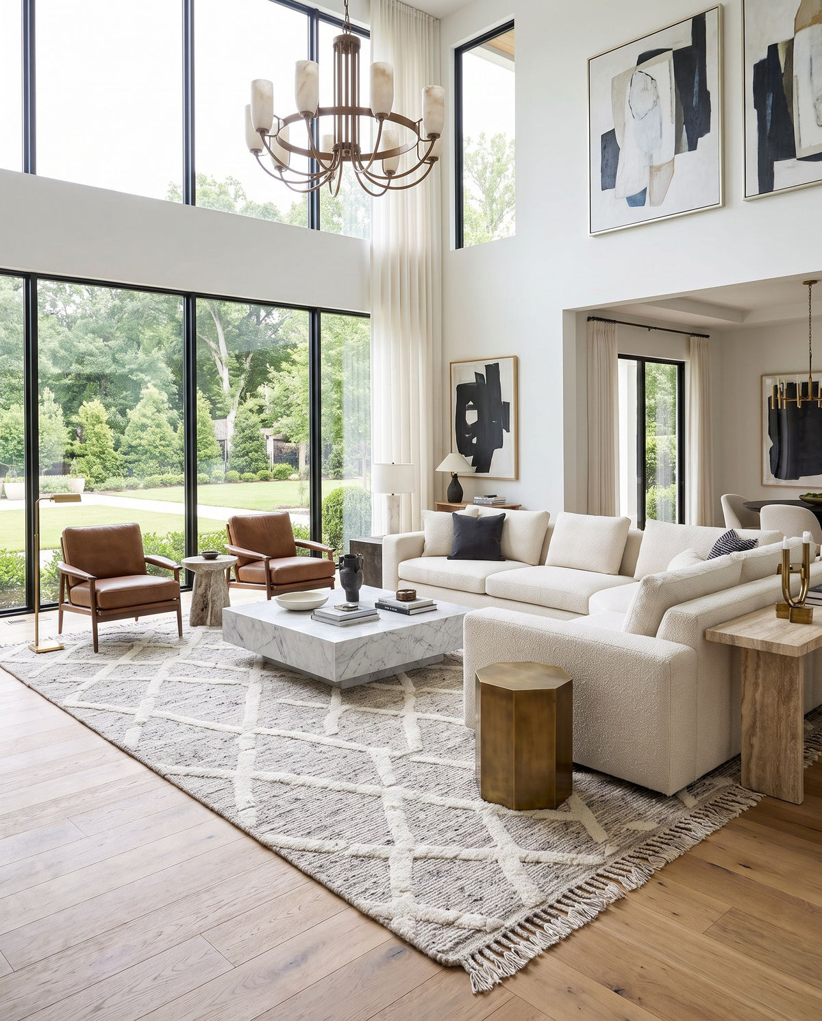 Tenerife TNF-2301 Hand Knotted Rug as the centerpiece of a bright luxury living room — a hand knotted global area rug in slate, beige, black and light gray tones