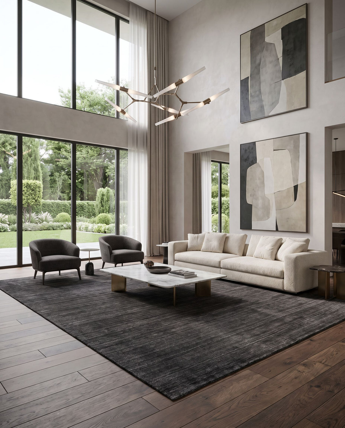 Torino TRN-2300 Hand Woven Rug as the centerpiece of a bright luxury living room — a hand woven modern area rug in black and light gray tones