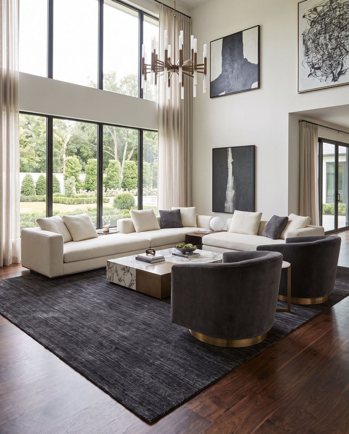 Torino TRN-2300 Hand Woven Rug styled in an elegant designer living room — hand woven modern area rug in black and light gray tones