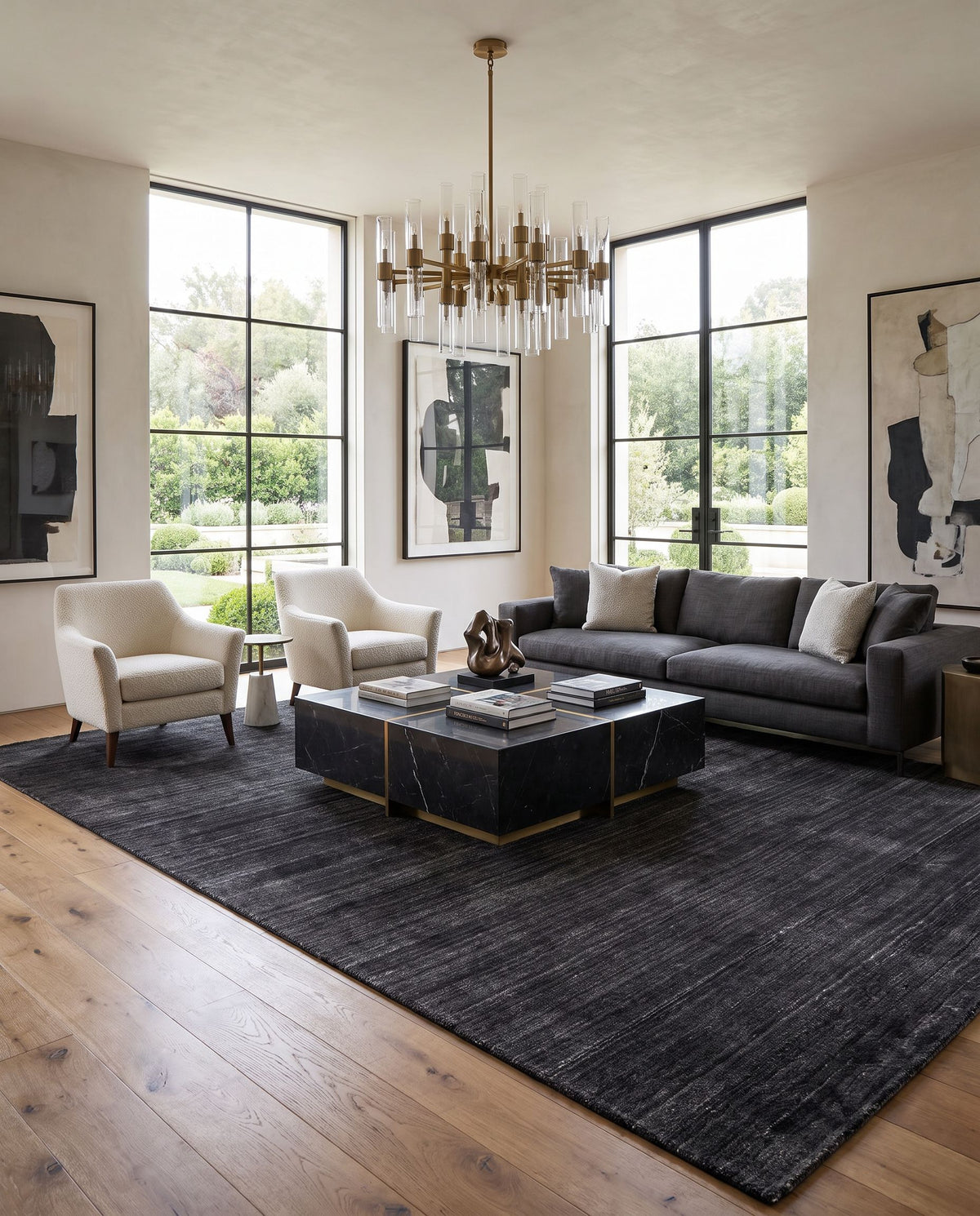 Torino TRN-2300 Hand Woven Rug styled in an elegant designer living room — hand woven modern area rug in black and light gray tones