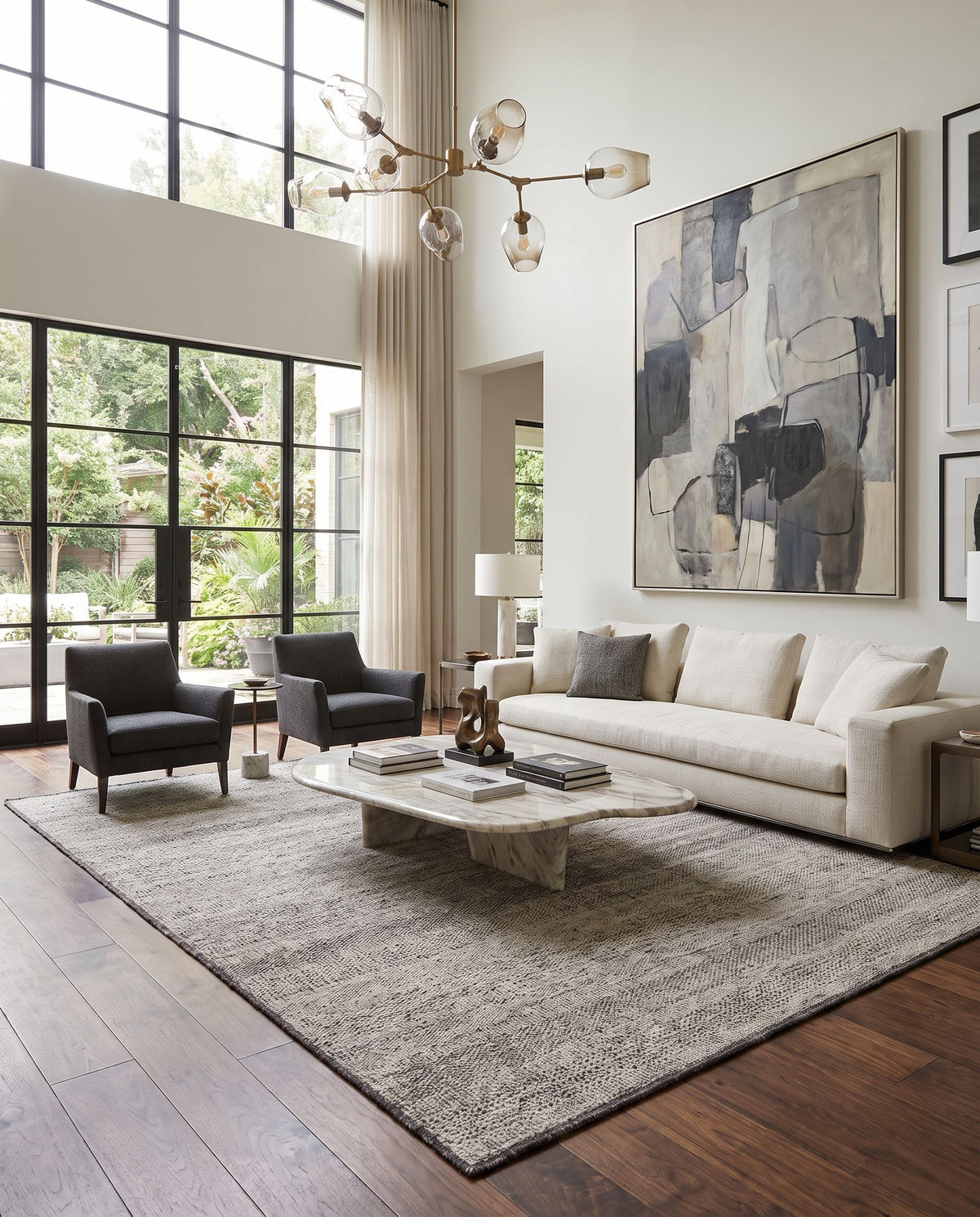 Tunus TUN-2305 Hand Knotted Rug styled in an elegant designer living room — hand knotted global area rug in gray, off-white, black and light sage tones