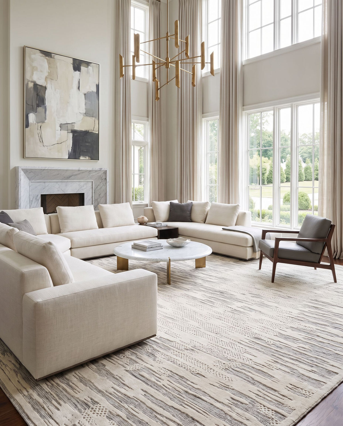 Tunus TUN-2315 Hand Knotted Rug as the centerpiece of a bright luxury living room — a hand knotted contemporary area rug in black, ivory and medium gray tones