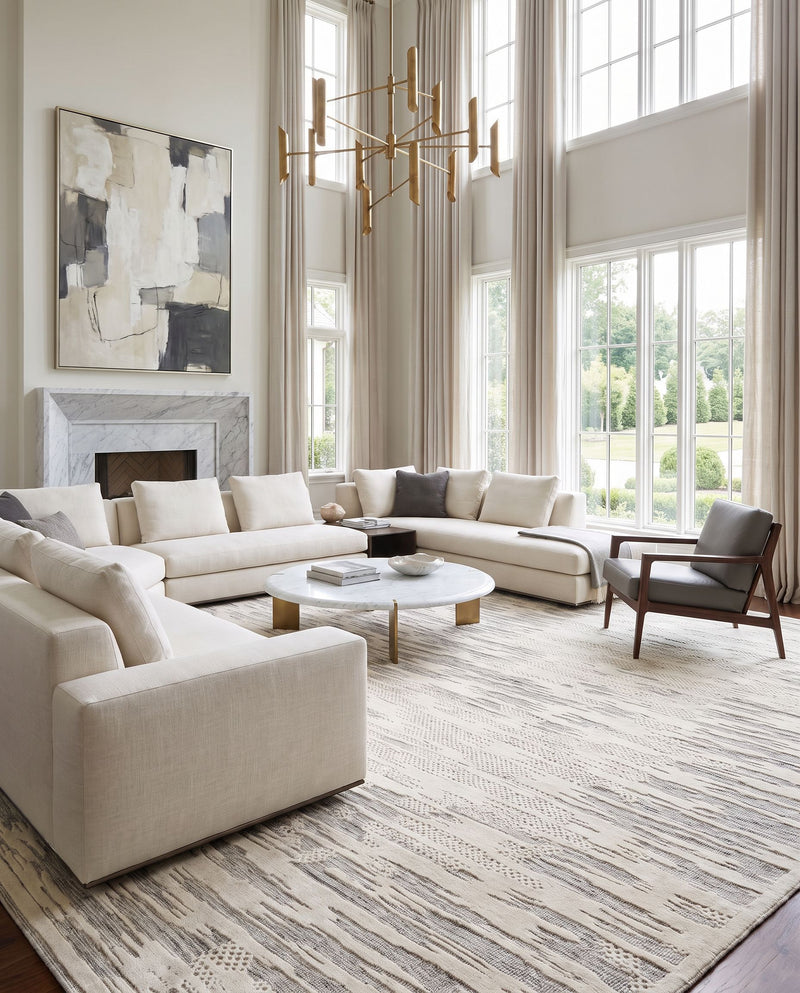 Tunus TUN-2315 Hand Knotted Rug as the centerpiece of a bright luxury living room — a hand knotted contemporary area rug in black, ivory and medium gray tones