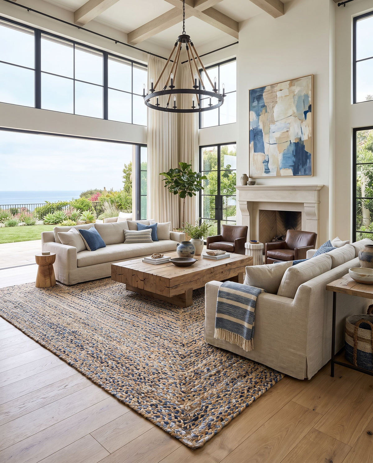 Trenzado TZD-2300 Hand Loomed Rug as the centerpiece of a bright luxury living room — a hand loomed modern area rug in tan, light blue and navy tones