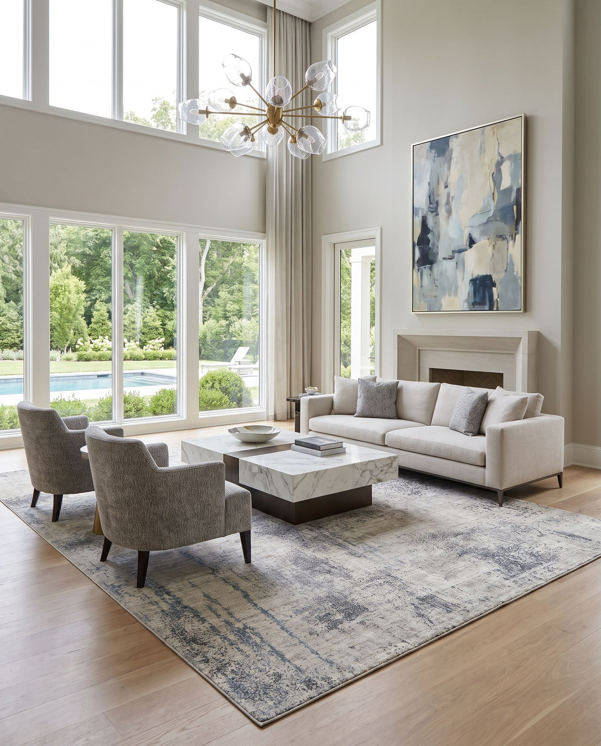 Wilson WSN-2313 Hand Loomed Rug styled in an elegant designer living room — hand loomed modern area rug in gray, ivory, black and blue tones