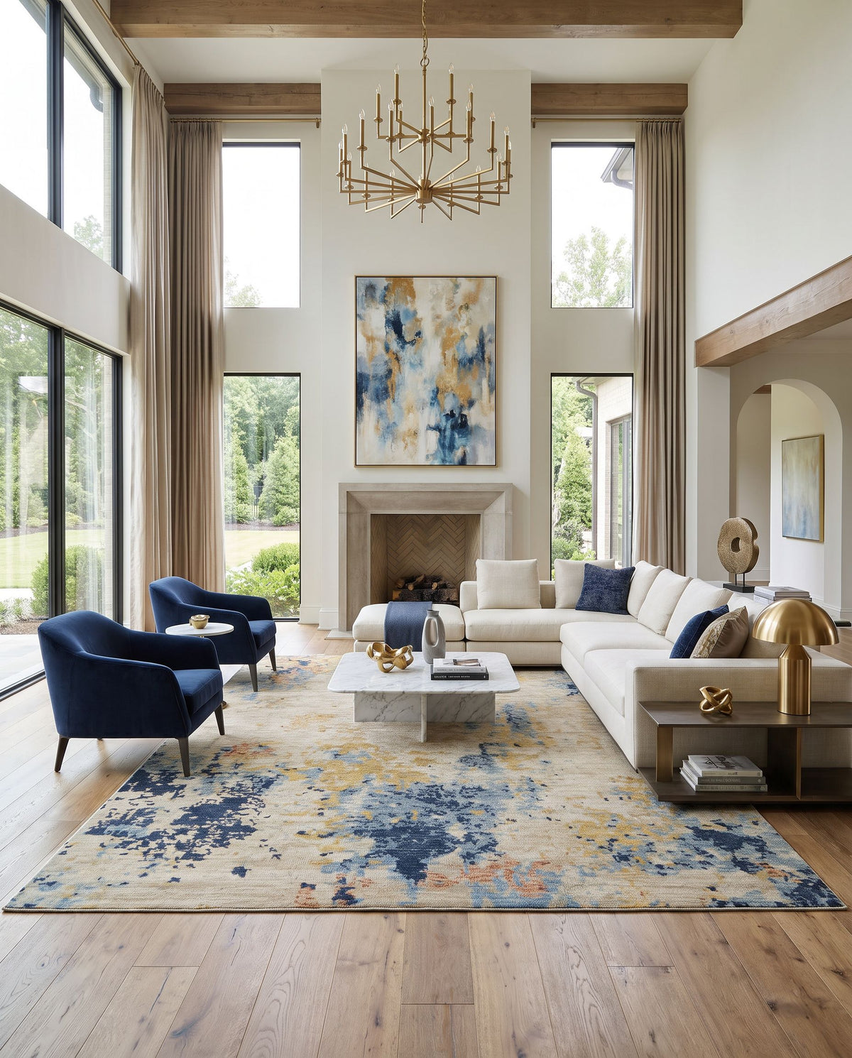 Odyssey ODY-2305 Hand Knotted Rug as the centerpiece of a bright luxury living room — a hand knotted modern area rug in denim, charcoal, light gray and light beige tones